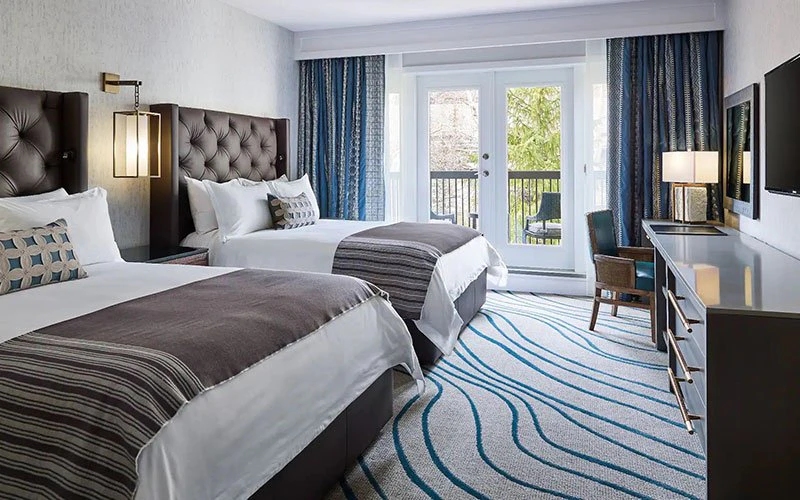 Grand Hyatt Vail ski-in/ski-out resort room with two double beds, balcony, and mountain views.