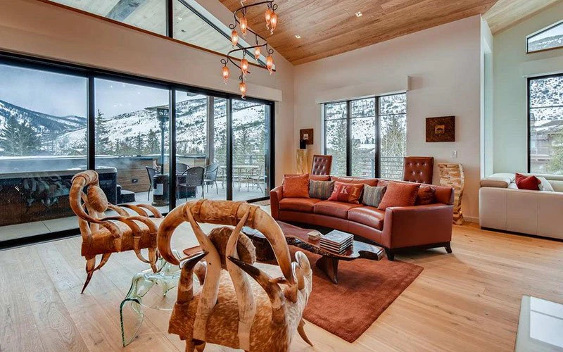 Golden Peak Penthouse Vail ski-in/ski-out condo with modern living area, mountain views, and designer furnishings.