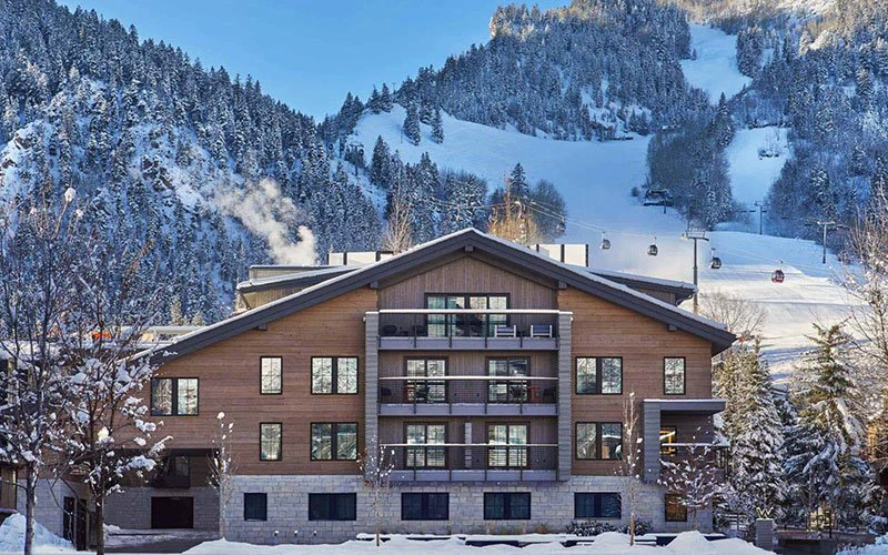 Exterior view of Sky Residences at the W, luxury Aspen ski-in/ski-out condos with direct slope access and mountain views.