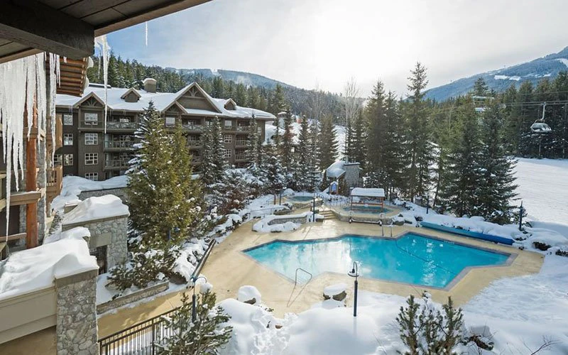 Blackcomb Springs Suites Whistler ski-in/ski-out hotel with outdoor heated pool and slope-side setting.