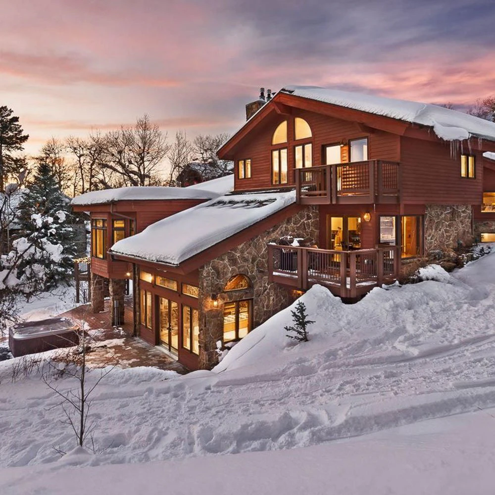 steamboat-ski-in-ski-out-intro-image-trails-edge-lodge Steamboat Springs Ski-in/Ski-out trail edge lodge with snow-covered roof and sunset views.