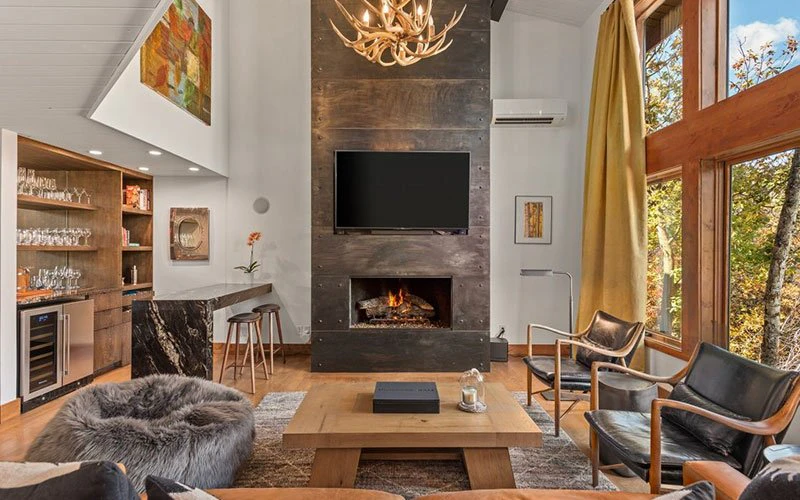 Cozy interior of Shadow Mountain Townhome, Aspen ski-in/ski-out accommodation with fireplace and mountain charm