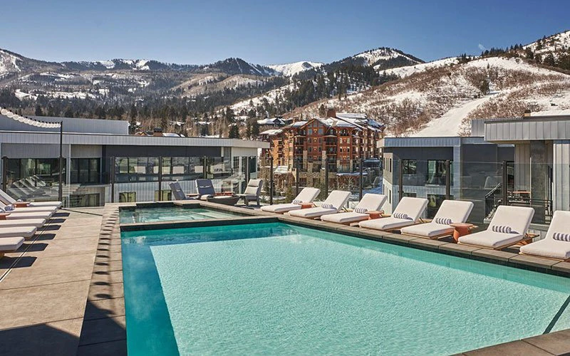 Outdoor heated rooftop pool at The Pendry, a luxury Park City ski-in/ski-out hotel in Canyons Village.