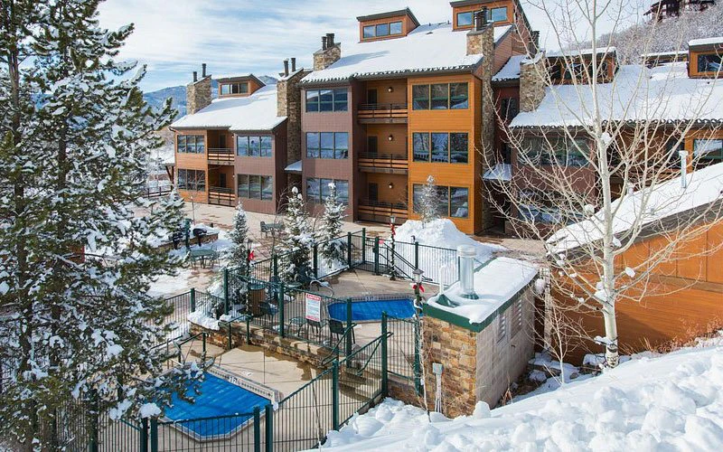 Kutuk property with multi-level condo units and snowy setting near Christie III lift in Steamboat Springs