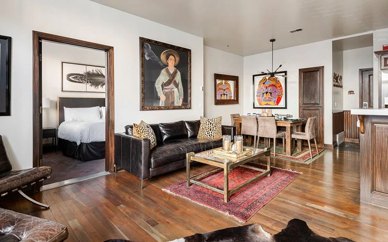 Lift Lodge Park City Condos stylish living and dining area with warm tones and ski-themed décor.