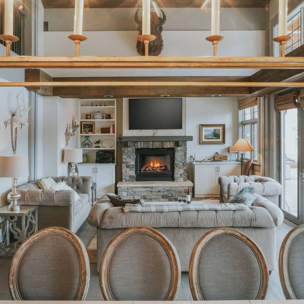 big-sky-condos-intro-image-snowcrest-condo Inviting living space at Snowcrest Lodge, a standout among Big Sky Condos with fireplace, neutral tones, and alpine elegance.