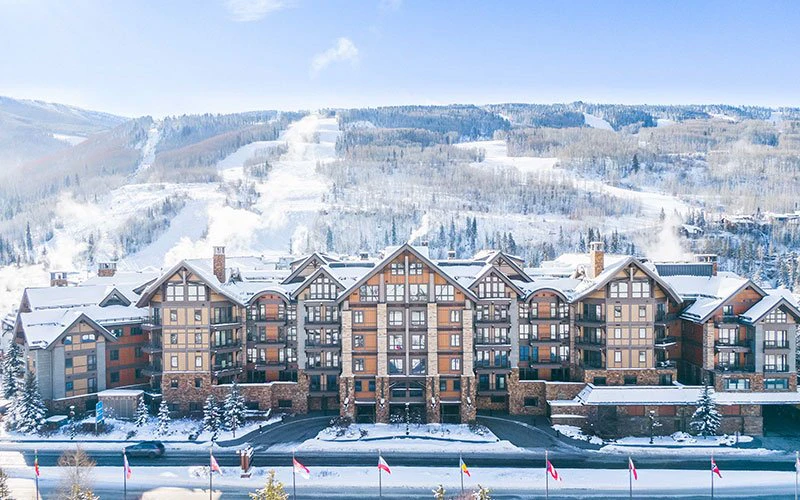 Elegant mountain condo buildings at Solaris Residences, luxury Vail Condos located in the heart of Vail Village with ski access and upscale amenities.