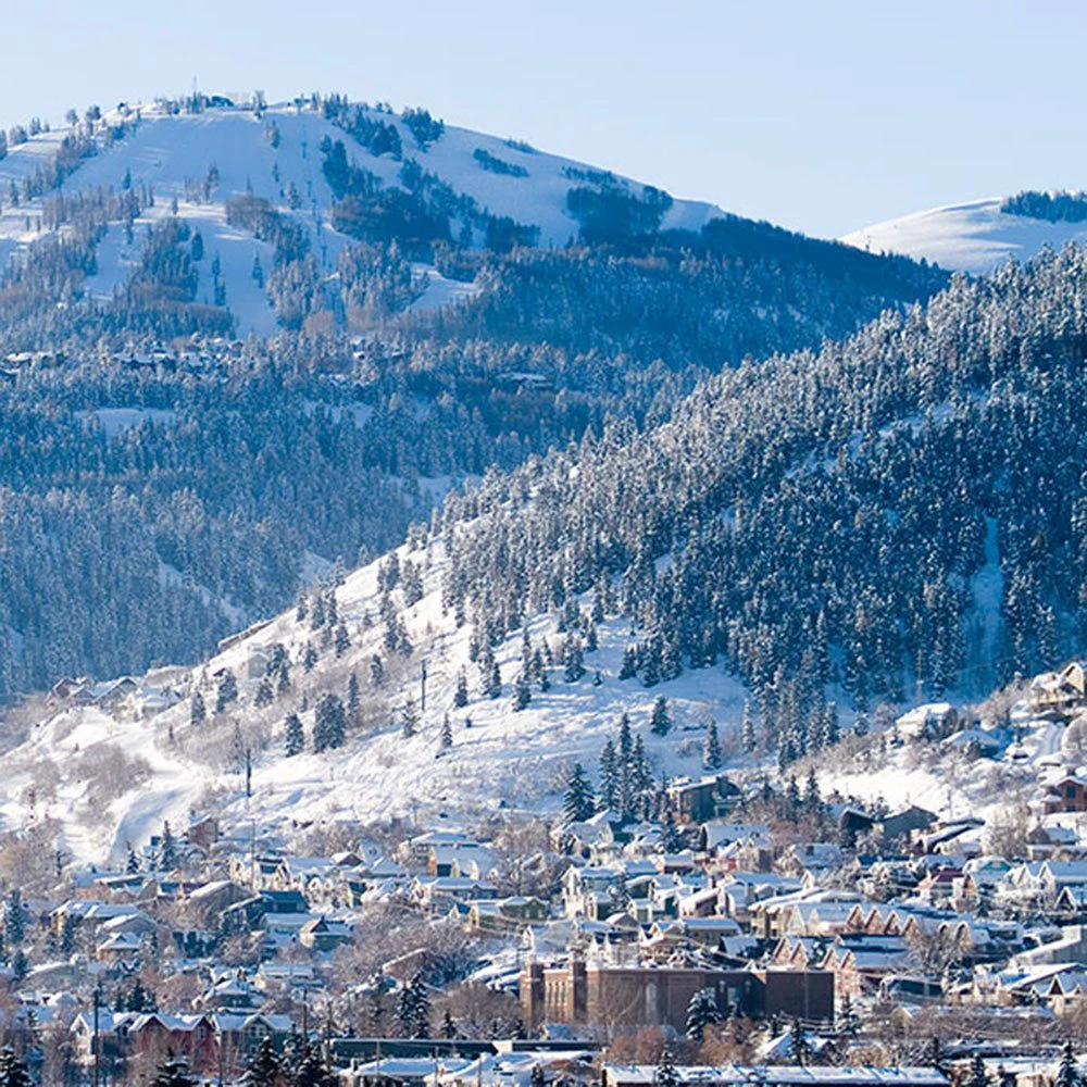 Snowy mountain landscape and historic Old Town in view, highlighting the scenic appeal of Park City Condos.