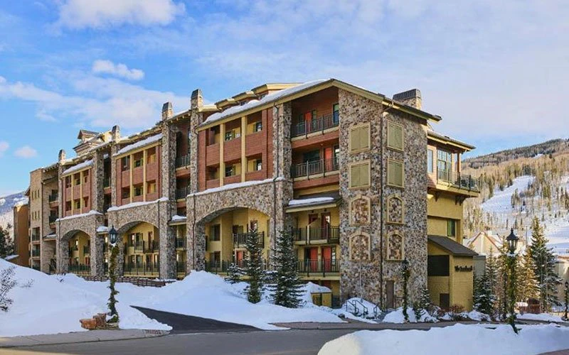 Exterior of The Landmark, a well-appointed Vail Condo near the Eagle Bahn Gondola with heated pool and mountain views.