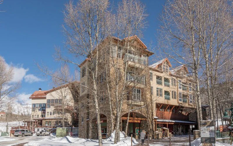 The Palmyra Telluride condos with alpine-style architecture and easy access to skiing and summer golf in Mountain Village.