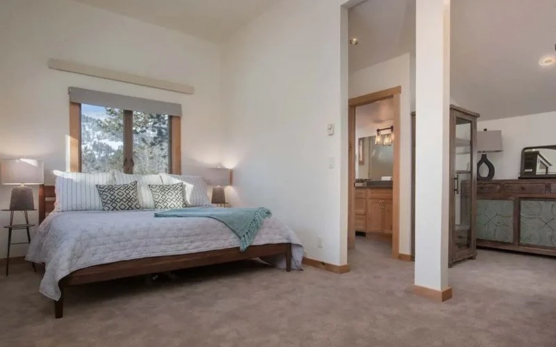 Indian Paintbrush Jackson Hole Condos spacious bedroom with mountain views and alpine-style furnishings.